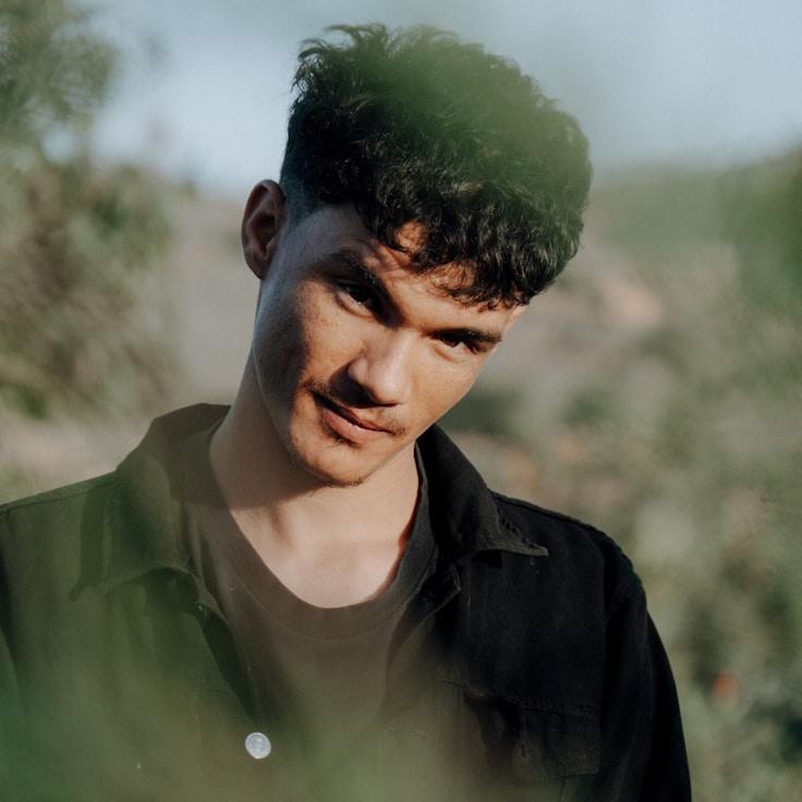 Alex Doe, Lead Design Curator at Digital Trend Framework, reviewing corporate floral arrangements